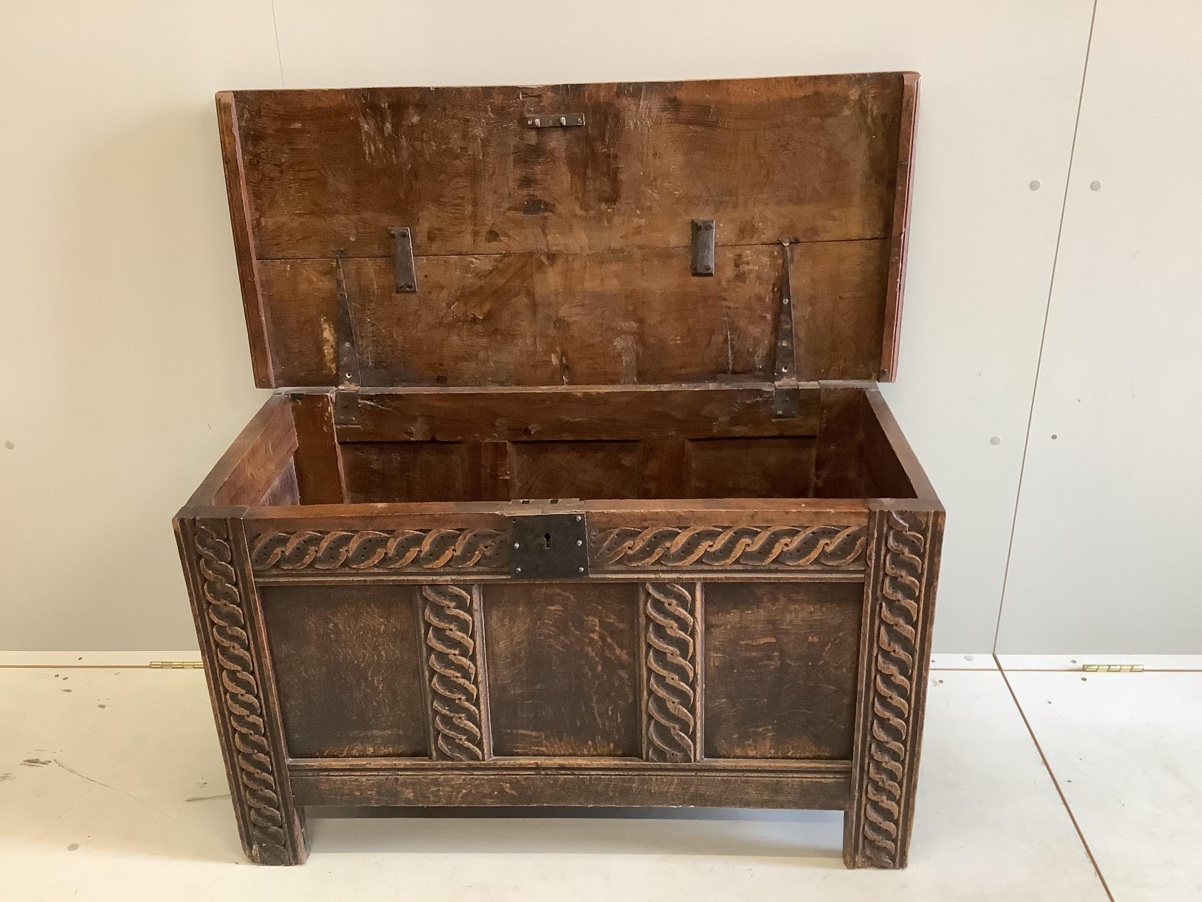 A 17th century panelled oak coffer, width 106cm, depth 48cm, height 61cm. Condition - fair
